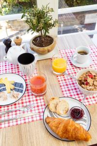 a table topped with plates of food on a table at Hôtel la Rotonde in La Croix-Valmer
