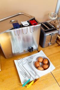 a counter with a plate of eggs and a toaster at Hôtel la Rotonde in La Croix-Valmer +8 photos