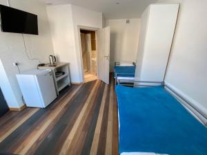a room with two beds and a flat screen tv at Noclegi in Starachowice