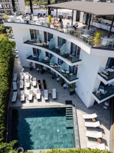 an aerial view of a building with a swimming pool at Blue Eye Hotel in Ksamil