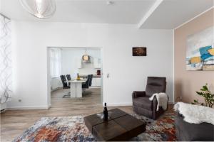 a living room with a couch and a table at Hafenblick in Waren