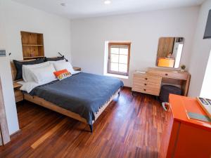 a bedroom with a bed and a dresser at Muyo House in Urla +104 photos
