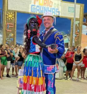 a man standing next to a woman in a colorful dress at Exclusive Guest House - Suites Charmosas na Vila in Porto De Galinhas +71 photos