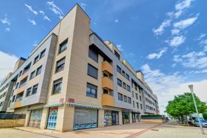 a building on a street with a blue sky at Las Gaunas by Clabao in Logroño