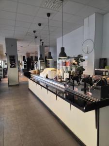 a kitchen with a counter in a restaurant at Hotell Centralstation in Uppsala