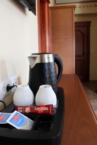 a coffee pot sitting on top of a table at Divan in Plav