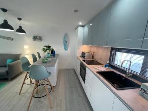 a kitchen with a sink and a counter top at MarVillaFuerte in Villaverde +84 photos