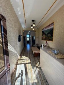 a room with a hallway with a living room at Mirage Hotel in Shinuhayr