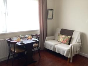 a room with a table and a chair and a table and a chair at The Meadows Bed and Breakfast in Monaghan
