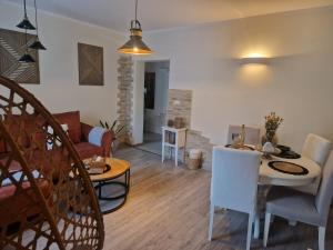 a living room with a table and a couch at PIK-KWATERY in Olsztyn