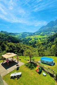 a woman standing on top of a hill with a view at Villa Amore in Oltre il Colle