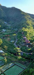 an aerial view of a village on a hill at Sada 360 Nanu Homestay in Sembalun Lawang