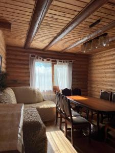 a room with a table and a dining room at Наше Місце in Krymno