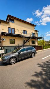a silver car parked in front of a building at Apartament Vila Draghici Eforie Sud in Eforie Sud