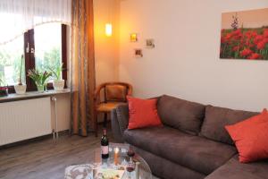 a living room with a couch and a table at Haus Hahn in Suhlendorf