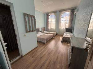 a large room with two beds and a kitchen at Mirage in Shinuhayr