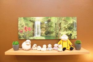 a group of stuffed animals sitting on a shelf at Ferienwohnung Heuer in Ebstorf