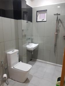 a bathroom with a toilet and a sink at Shalom View Homestay in Kandy +34 photos