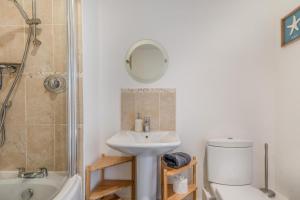 a bathroom with a sink and a toilet and a shower at 3 Bed in Chathill oc-61892 in Beadnell +18 photos