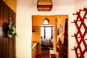 a hallway with a room with a bed and a mirror at Peaceful Oasis Black Forest in Schonach