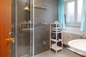 a bathroom with a shower and a sink at Haus Belchenwind in Münstertal +74 photos
