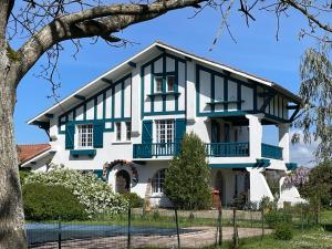 a house with blue and white trim at Saint Sever des Pyrenees in Saint-Sever-de-Rustan