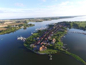an aerial view of a small island in a body of water at Schleiblick App 4 in Rabenkirchen-Faulück +8 photos