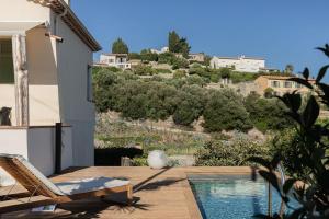 a villa with a swimming pool and a house at Maison Le Poete in Vallauris