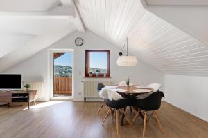 a dining room with a table and chairs at Hegauzauber in Tengen