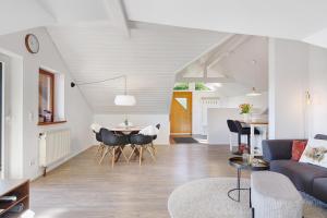 a living room with a couch and a table at Hegauzauber in Tengen
