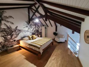 a bedroom with a large bed in a room at Évasion Tropicale - vue et plage à 2 min in Les Trois-Îlets