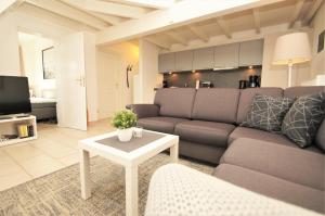 a living room with a couch and a table at Nixe in Dahme