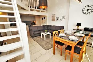 a living room with a table and a couch at Nixe in Dahme