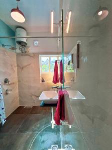 a bathroom with a sink and a window at Comfort and Cozy in Orchha +41 photos