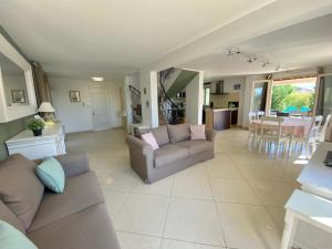 a living room with a couch and a table at La Bastide in Saint-Saturnin-lès-Apt