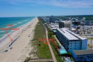 a view of a beach with buildings and the ocean at Casa Al Mare in Carolina Beach