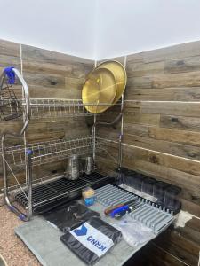 a dish rack in a kitchen with a wooden wall at Farida Nile view in Luxor