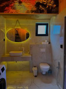 a bathroom with a sink and a toilet at Vlasic Odmor - Villa Biser & spa in Vlasic +29 photos