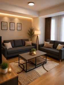 a living room with two couches and a coffee table at SOLU Luxury Apartments with Free Parking ,Fast Wi -Fi, New Building in Skopje