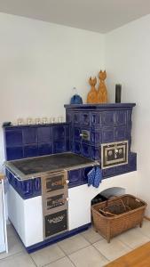 a kitchen with a blue island with a counter top at Statek Bavorov in Bavorov