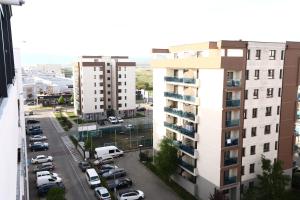 an aerial view of a parking lot with buildings at FLH - Sunset Horizon near Shopping City with parking in Şelimbăr