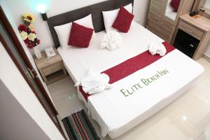 Кровать или кровати в номере Elite Beach Inn