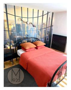 a bedroom with a red bed with a large window at Maison 1925, Méricourt 62 in Méricourt