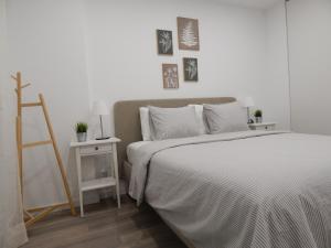 a bedroom with a bed and a table with a ladder at Casa Bella Arch, 2 min walk to beach Praia da Rocha in Portimão +27 photos