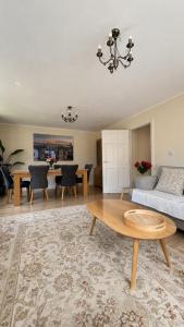 a living room with a couch and a table at 2 Bedroom Flat in Manchester