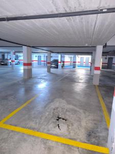 an empty parking lot with cars parked in it at Cullera Playa Racó in Cullera +67 photos