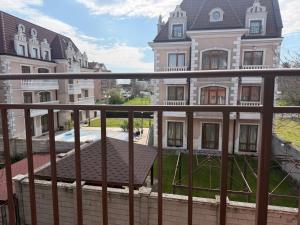 a view of a building from a balcony at Корал in Obzor