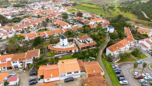 an overhead view of a town with orange roofs at Banyan Tree in Óbidos