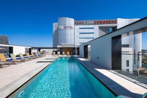 a swimming pool on the roof of a building at Alexandre Fira Congress in Hospitalet de Llobregat