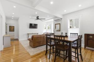 a living room with a table and a couch at Historic home on Salem Neck in Salem